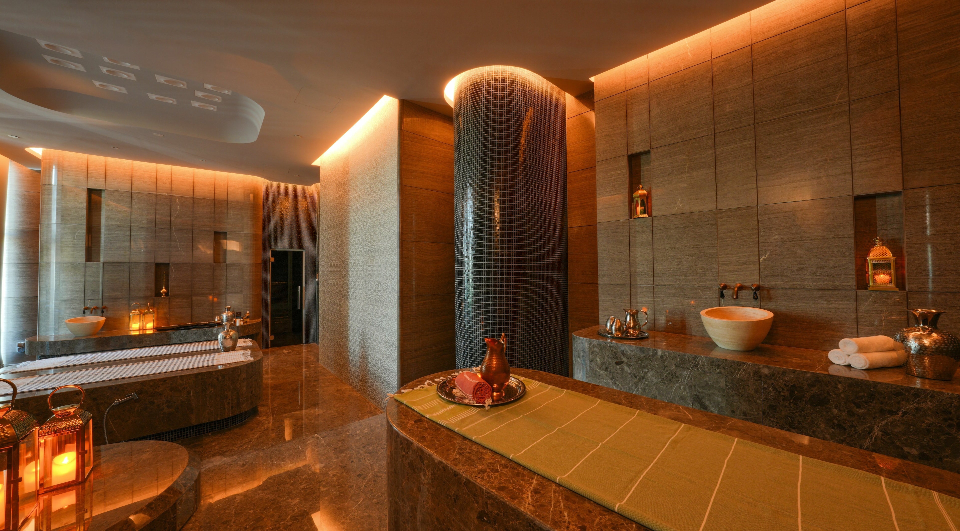 Luxurious spa at Wellbeings Holistic Healing, Marriott Jewel of the Creek, Dubai, AE with warm lighting.