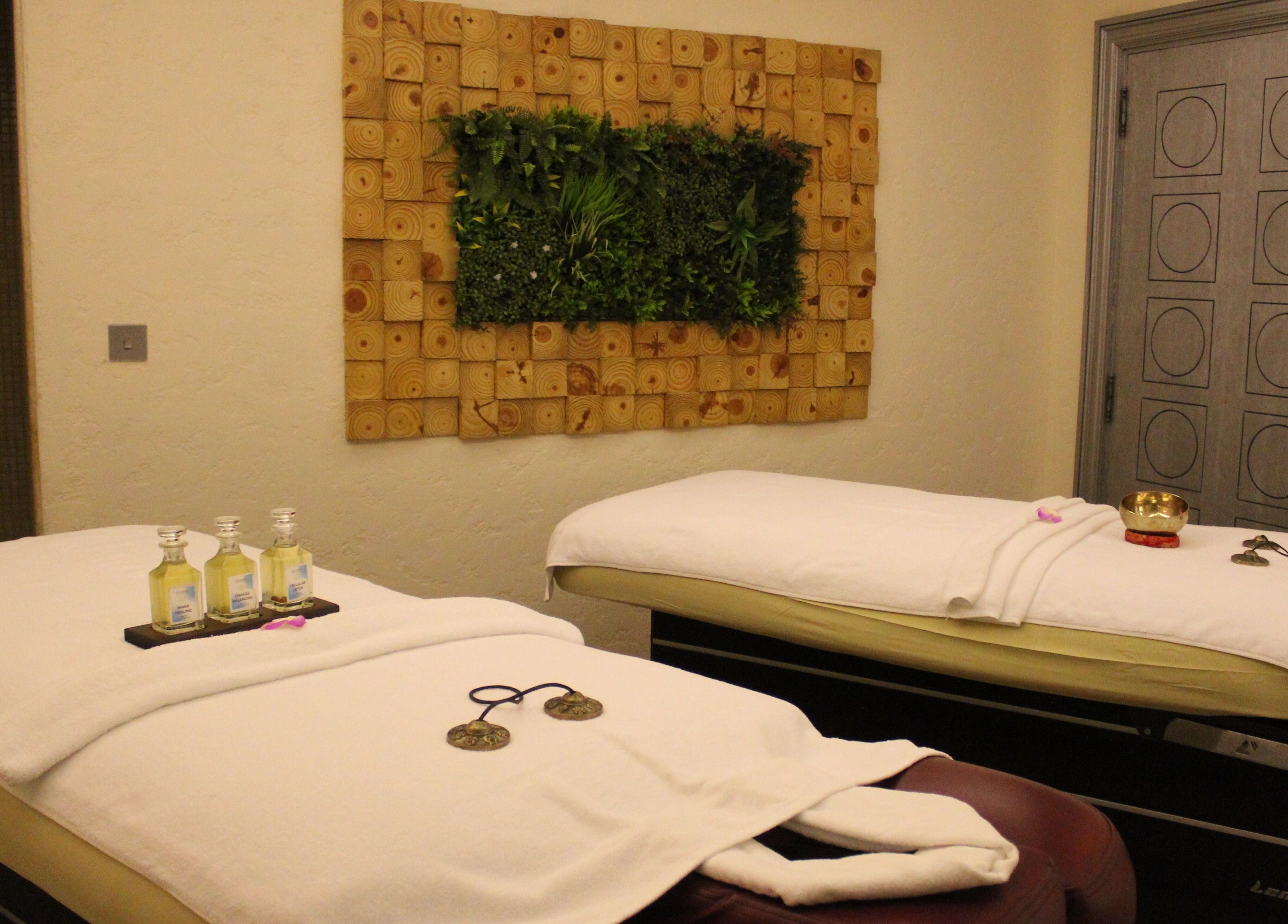 Relaxing massage room at Wellbeings Holistic Healing - Fairmont, Dubai, offering a tranquil escape in Dubai, AE.