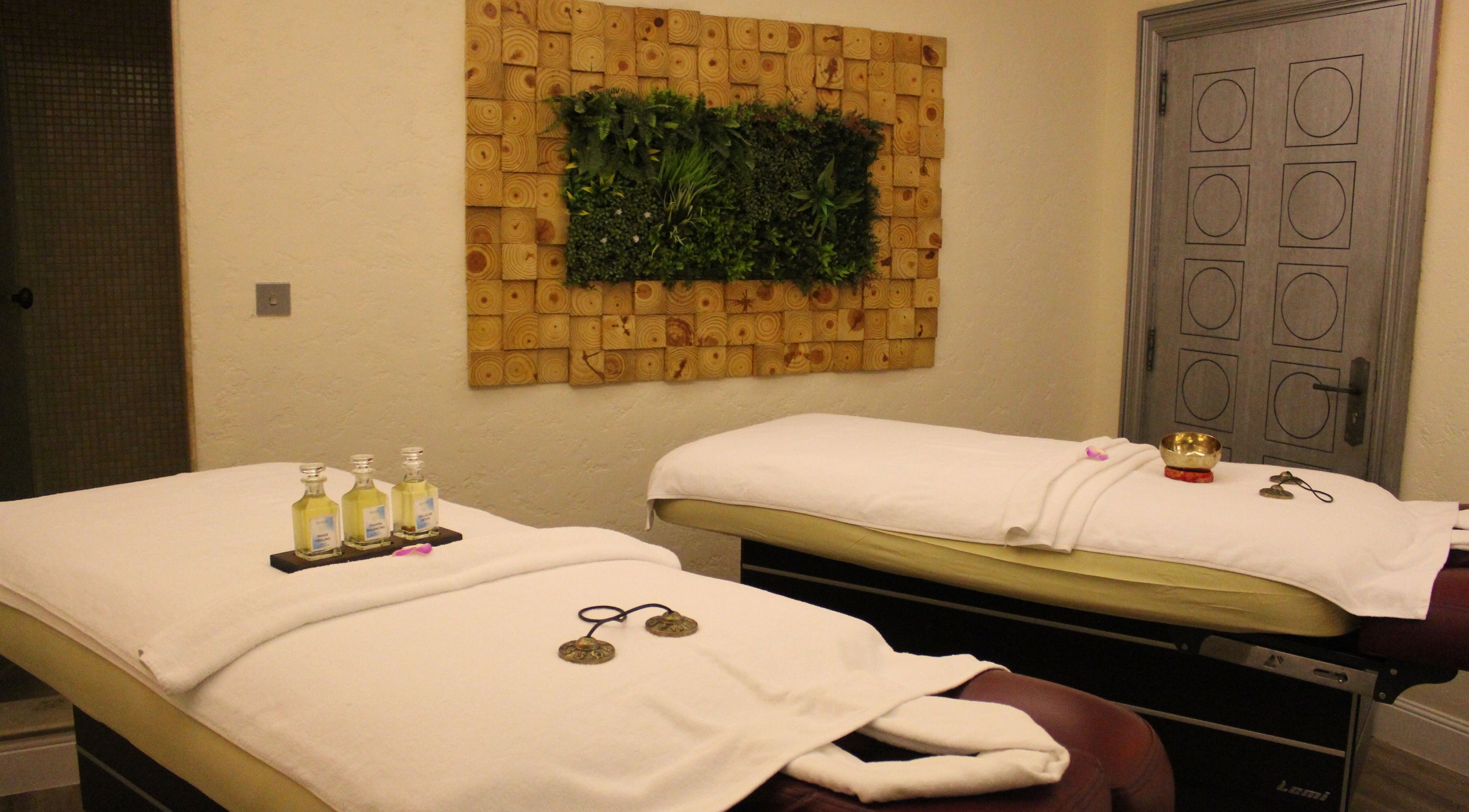 Relaxing massage room at Wellbeings Holistic Healing - Fairmont, Dubai, offering a tranquil escape in Dubai, AE.