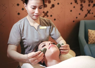 Facial massage with stones at Wellbeings Holistic Healing, Fairmont, Ajman. Experience relaxation in Ajman, AE.