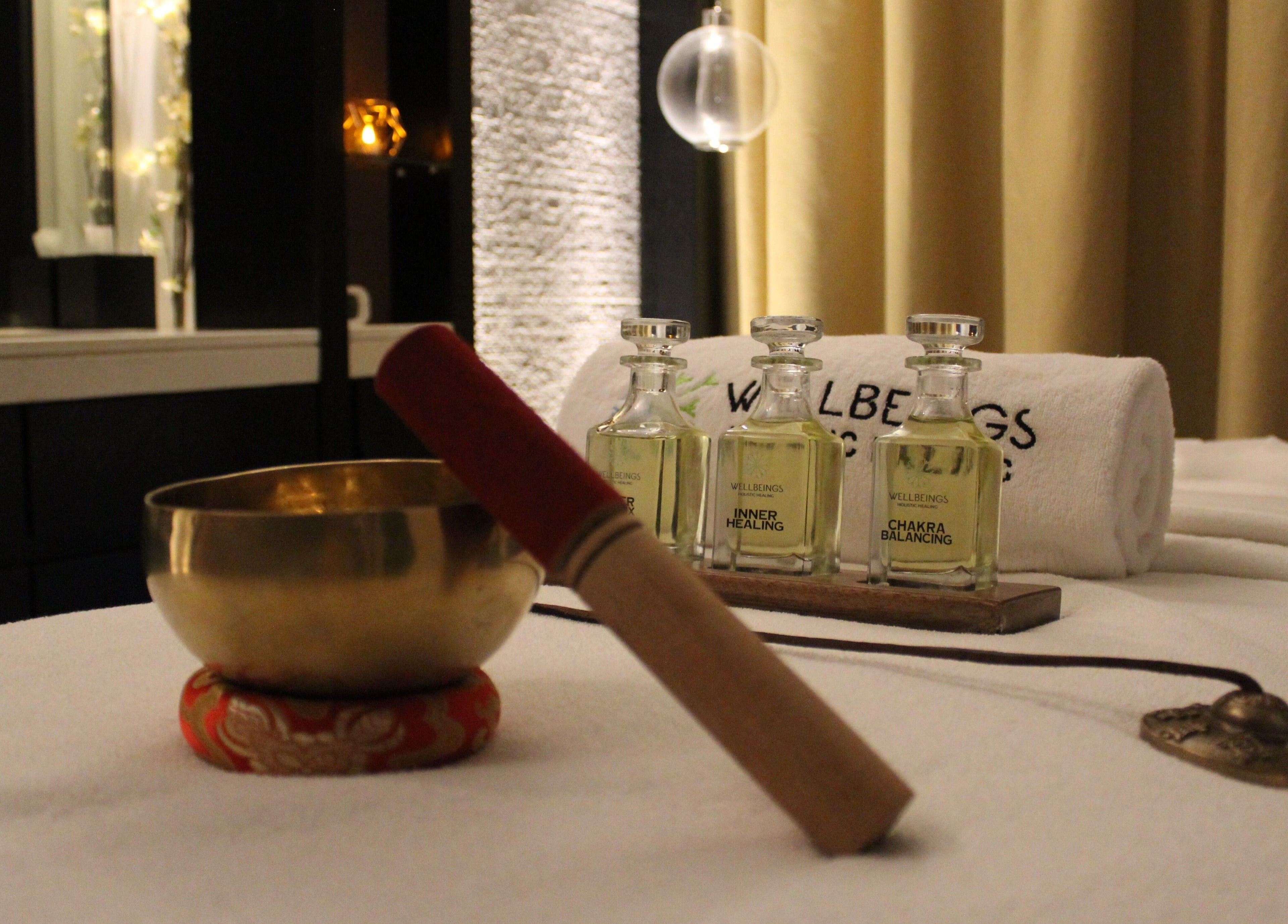 A serene spa setup at Wellbeings Holistic Healing in Dubai, AE with oils and traditional instruments.