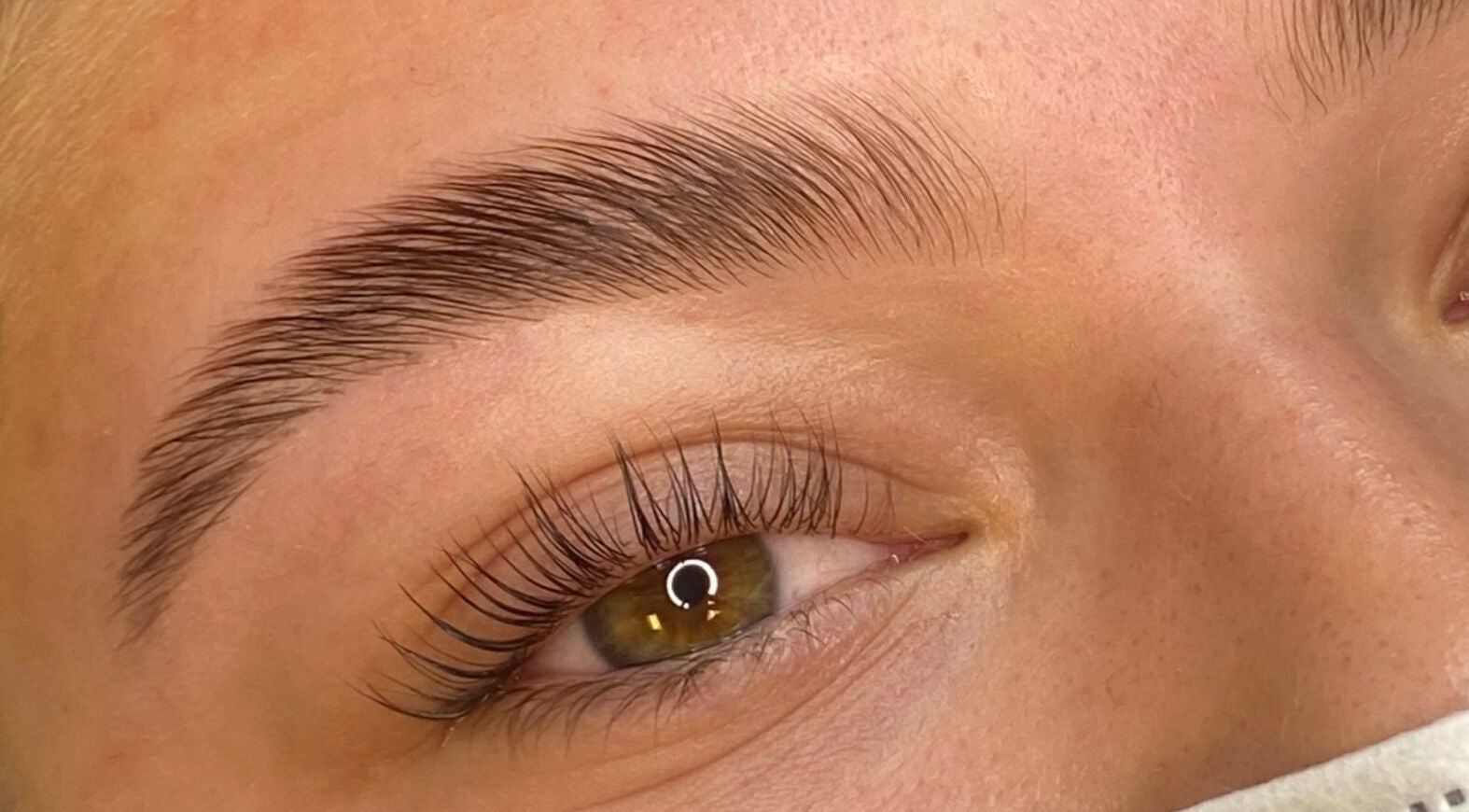 Perfectly groomed eyebrow at Selkie Skin, Mevagissey, England, GB, enhancing natural beauty.