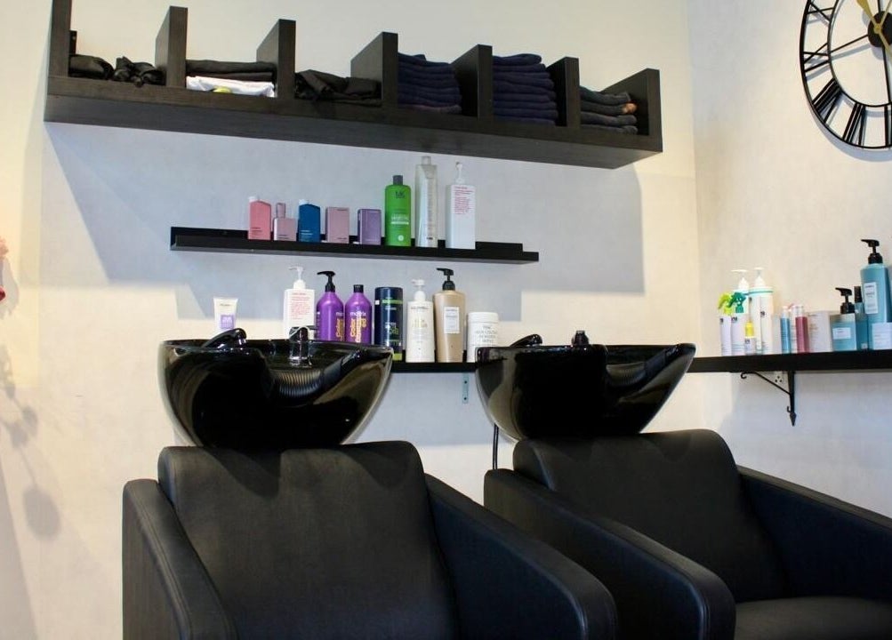Stylish hair washing station at Freya Beauty Salon JVC, Dubai, Dubai, AE, featuring modern sinks and shelves.