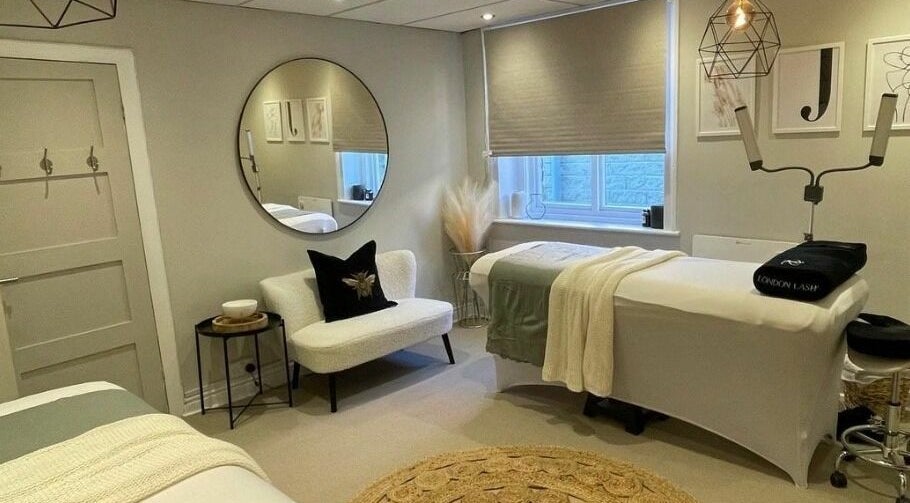 Relaxing treatment room at The Lash Clinic Huddersfield, Huddersfield, England, GB with modern decor and comfortable seating.