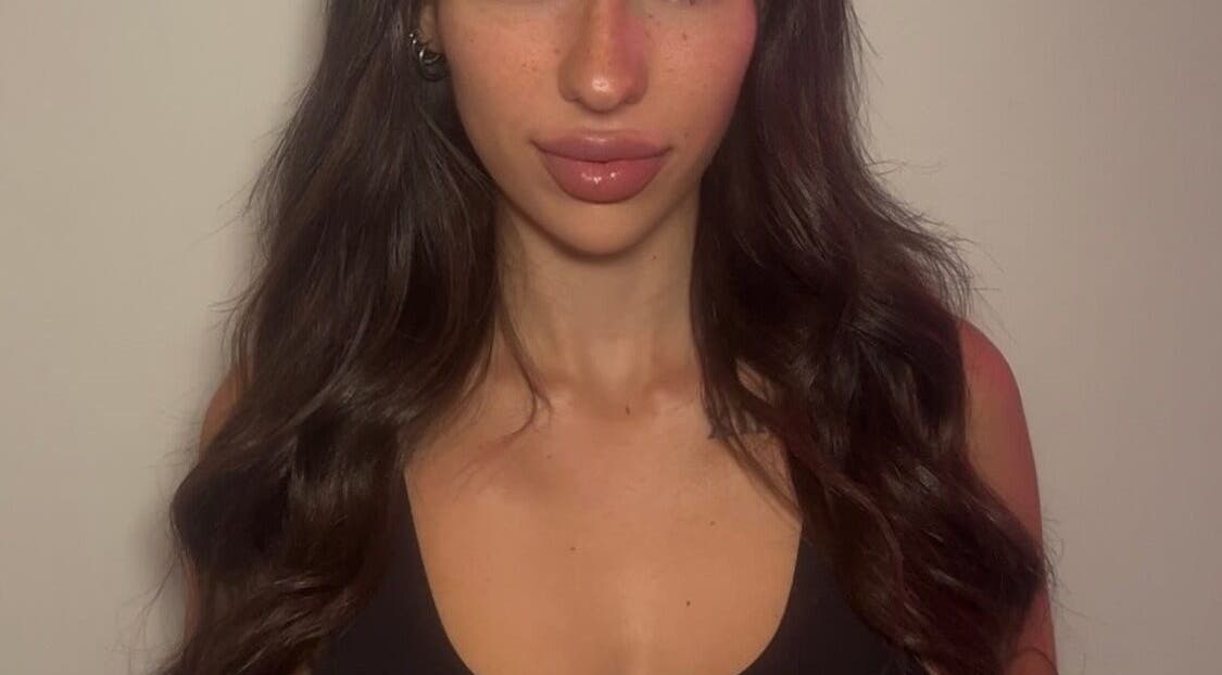 Elegant woman with styled hair at KiKi Glam and Co, Melbourne, Victoria, AU.