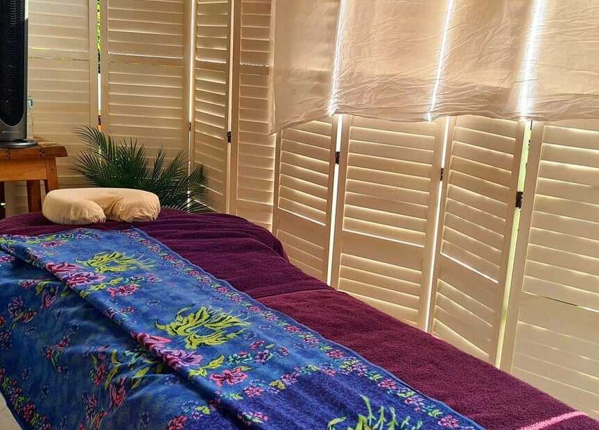 Relaxing massage room at Santé Spa Retreat, Sandiway, England, GB, featuring a cozy massage table.