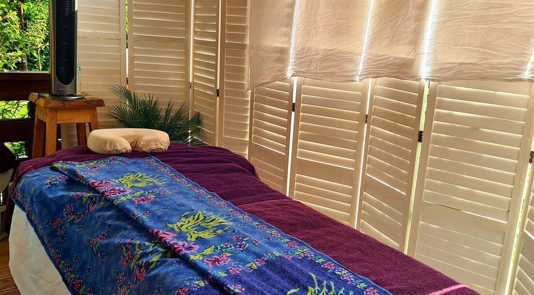 Relaxing massage room at Santé Spa Retreat, Sandiway, England, GB, featuring a cozy massage table.