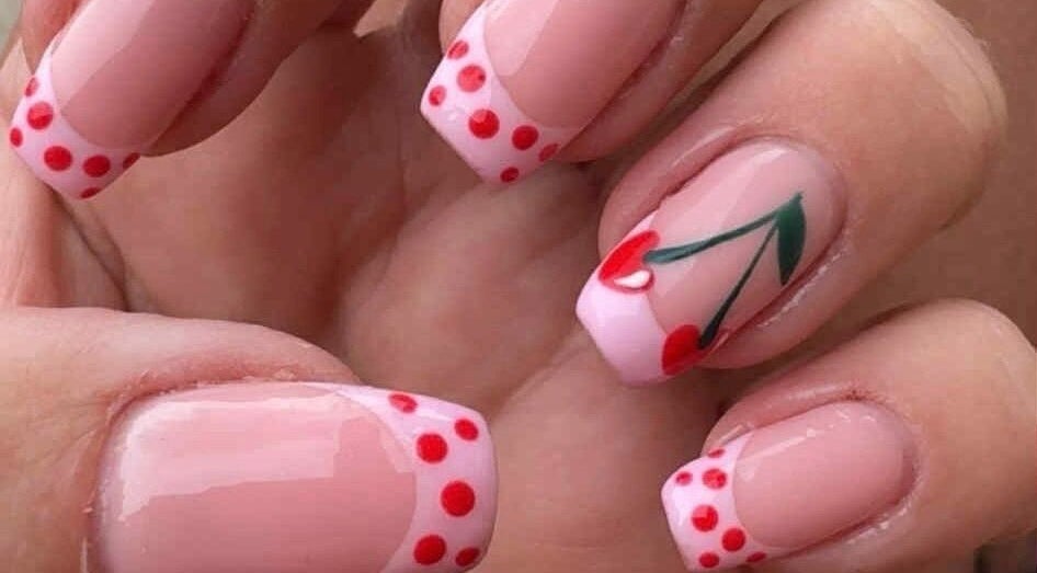 Cherry and polka dot nail art at Beauty at Dee’s, Newcastle upon Tyne, England, GB. Perfectly manicured nails.