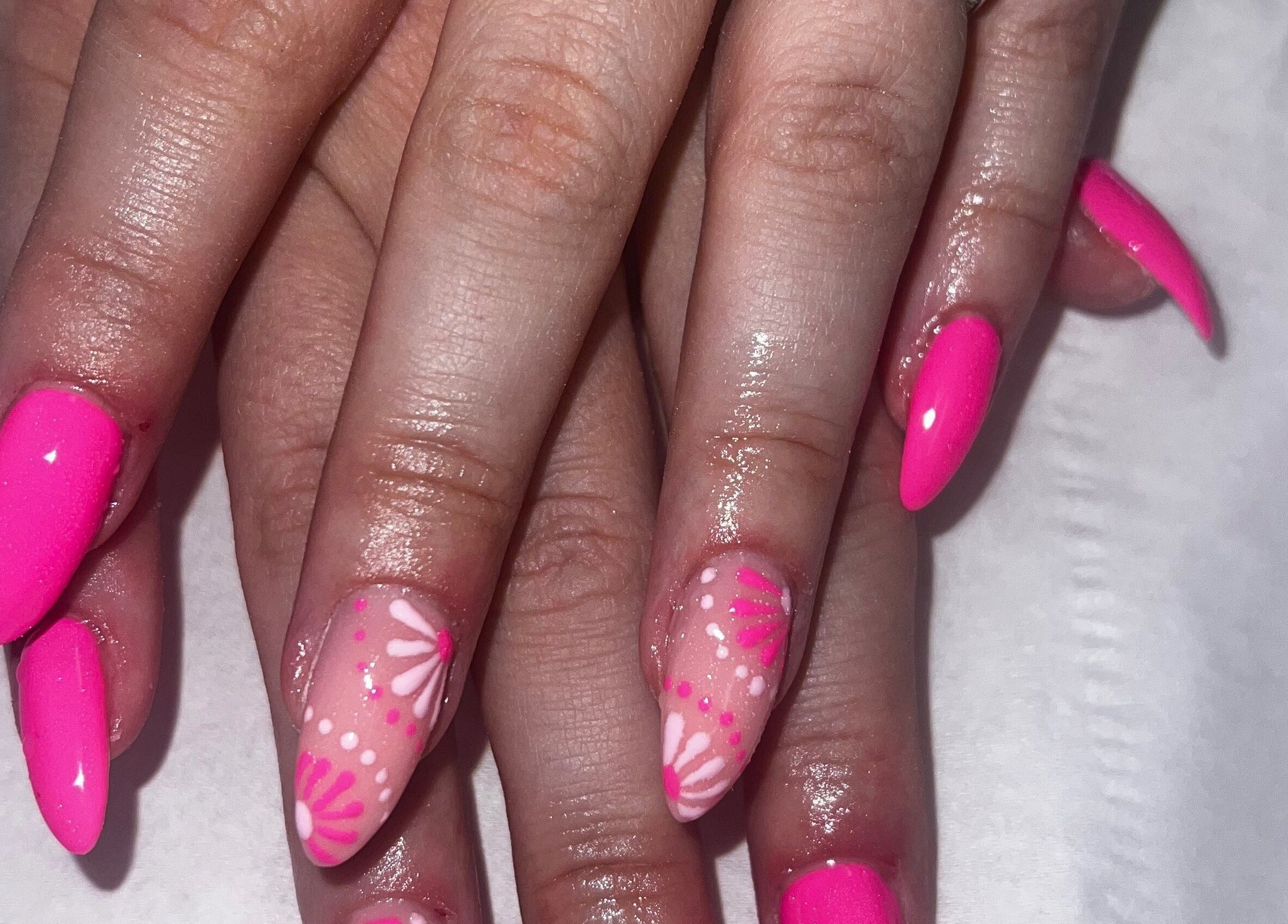 Bright pink nail art with floral designs at Beauty at Dee’s, Newcastle upon Tyne, England, GB.