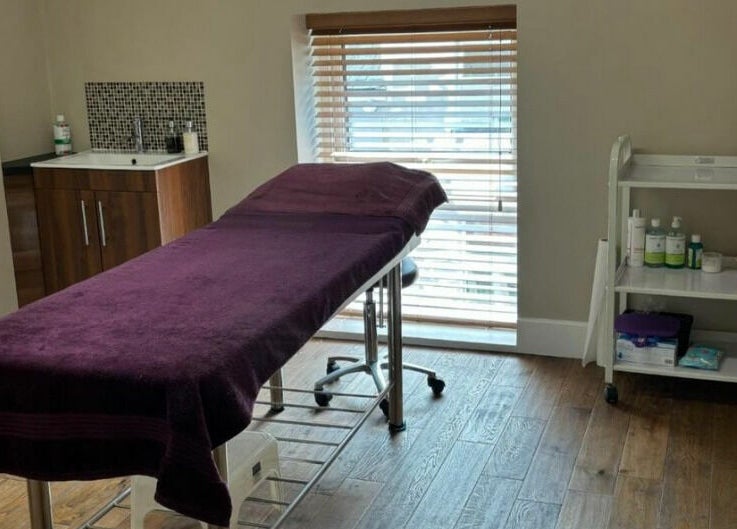 New Image's peaceful therapy room with massage table in Bangor, Wales, GB for wellness treatments.
