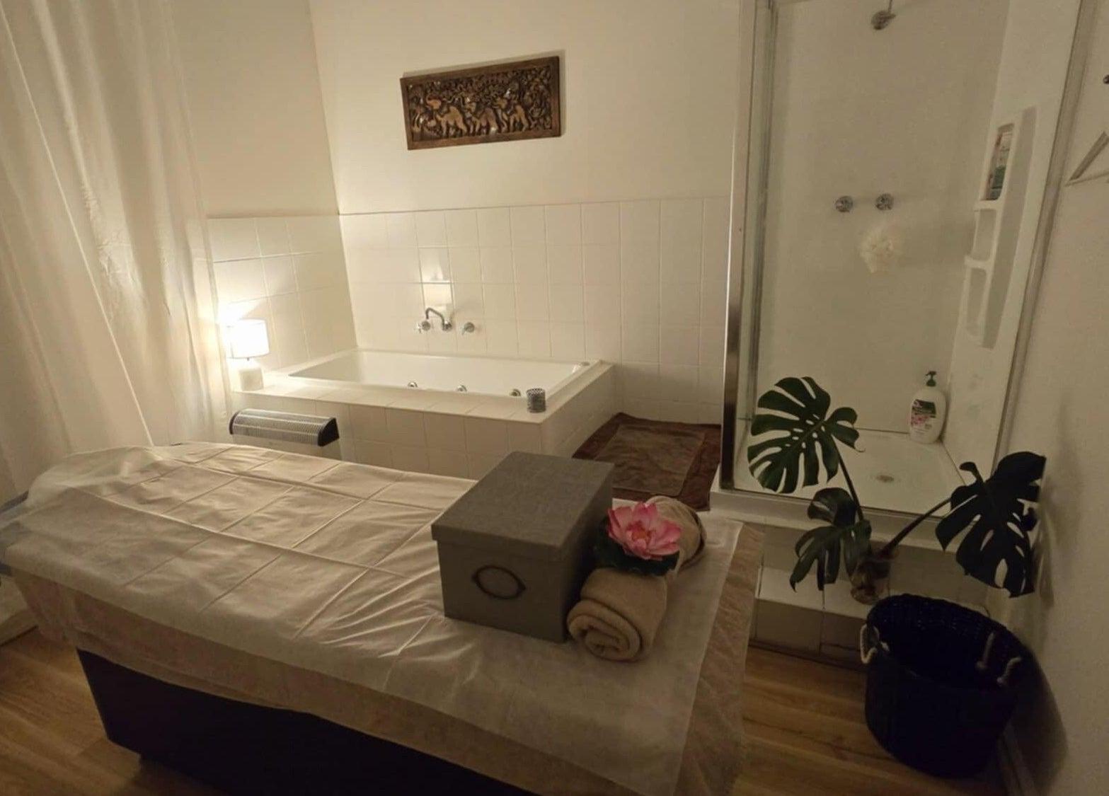 Tranquil massage room at Uni Massage Day Spa in Melbourne, Victoria, AU with a massage table and soothing decor.