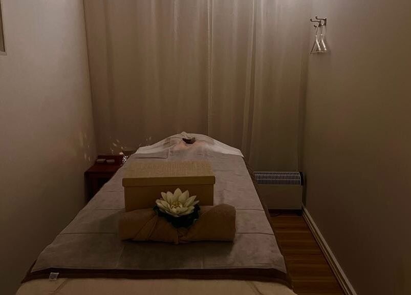 Relaxing massage room at Uni Massage Day Spa in Melbourne, Victoria, AU with soft lighting and a massage table.