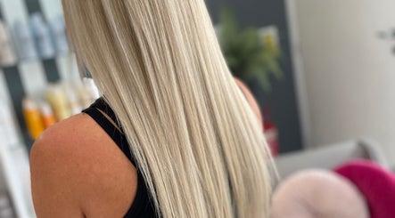 Blonde hair styled at Natalie Ibbs Hair in Chelmsford, England, GB, showcasing sleek and smooth finish.