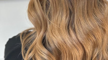 Close-up of golden waves styled at Natalie Ibbs Hair, Chelmsford, England, GB.