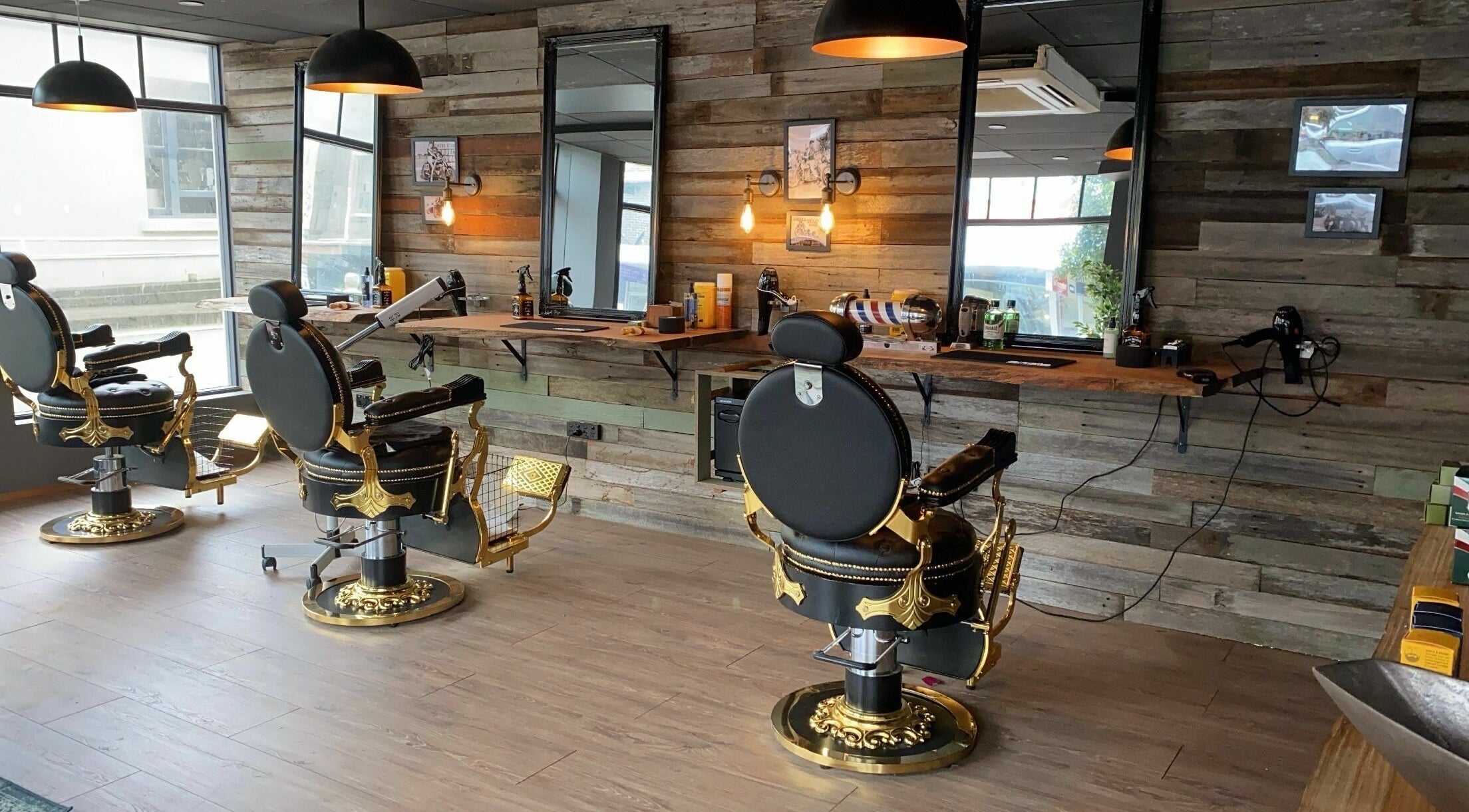 Interior of House of Handsome Barbershop | Waverley with vintage chairs and wooden decor in Waverley, New South Wales, AU.