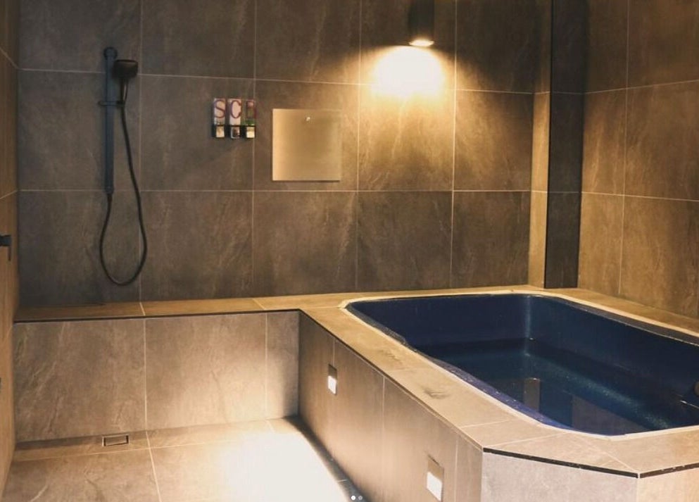 Luxurious bath at The Wellness Hub - Macarthur, Mount Annan, New South Wales, AU. A tranquil spa experience.