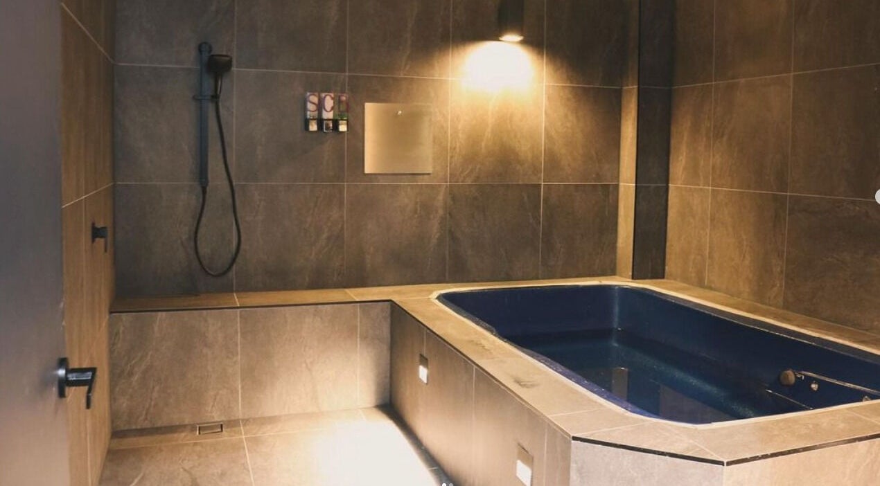 Luxurious bath at The Wellness Hub - Macarthur, Mount Annan, New South Wales, AU. A tranquil spa experience.