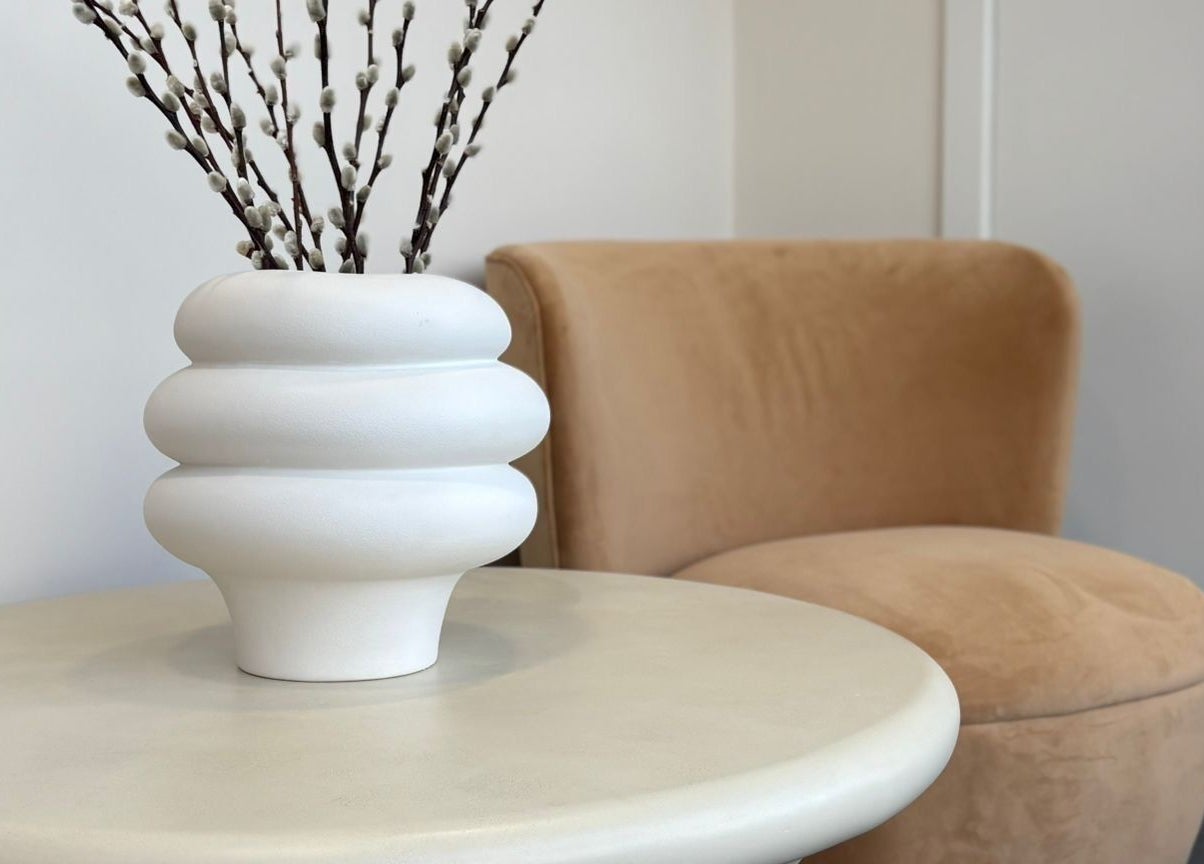 Elegant vase and plush chair in tranquil corner at By Lennon Beauty & Waxing, Edinburgh, Scotland, GB.