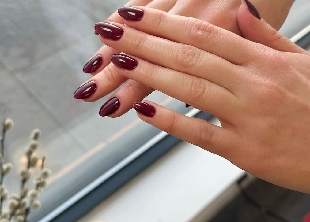 Stylish maroon nails by Lennon Beauty & Waxing, Edinburgh, Scotland, GB, offering chic manicures.