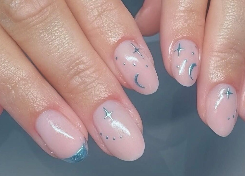 Elegant celestial nail art by Lennon Beauty & Waxing, Edinburgh, Scotland, GB. Features stars and moon design.