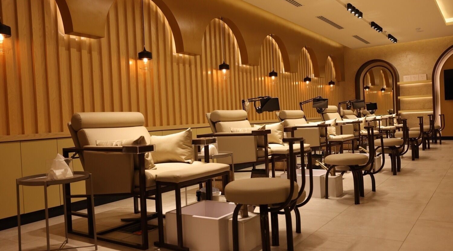 Luxurious seating at Plush Nail Boutique - Al Mutamarat, Riyadh, SA, showcasing premium nail care ambiance.