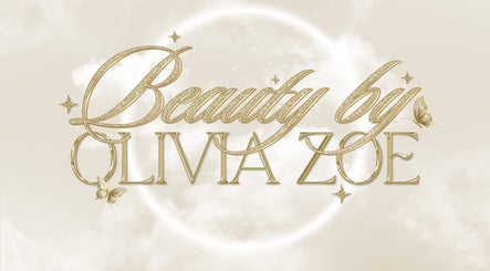 Glamorous logo for Beauty by Olivia Zoe, Seaton, England, GB, with gold script on a soft cloud background.