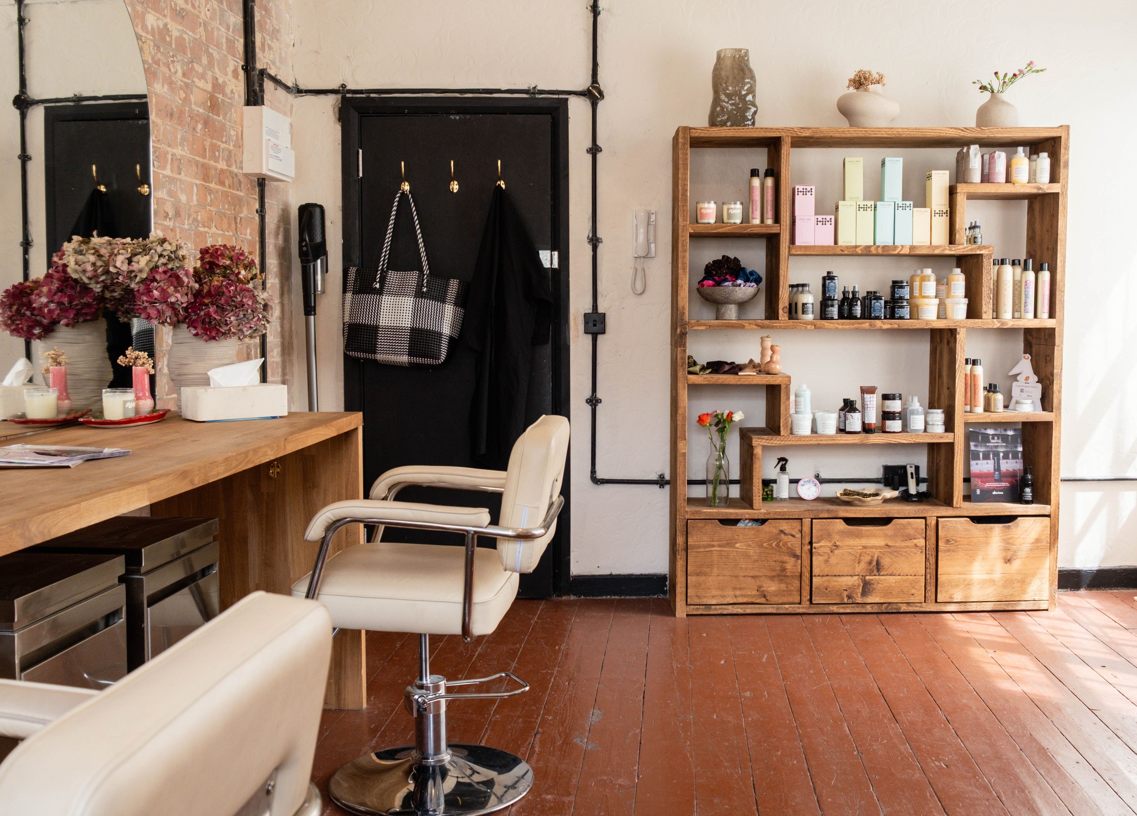 Inside Fluff.Hackney: cozy salon setup with products in London, England, GB.