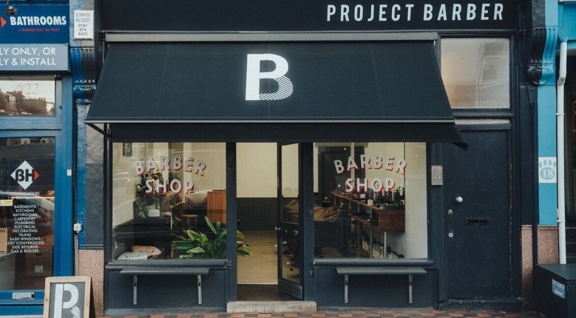 Front view of Project Barber shop in London, England, GB, showcasing modern and inviting exterior façade.