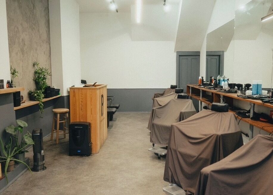 Modern interior of Project Barber with sleek stations in London, England, GB, showcasing contemporary style.