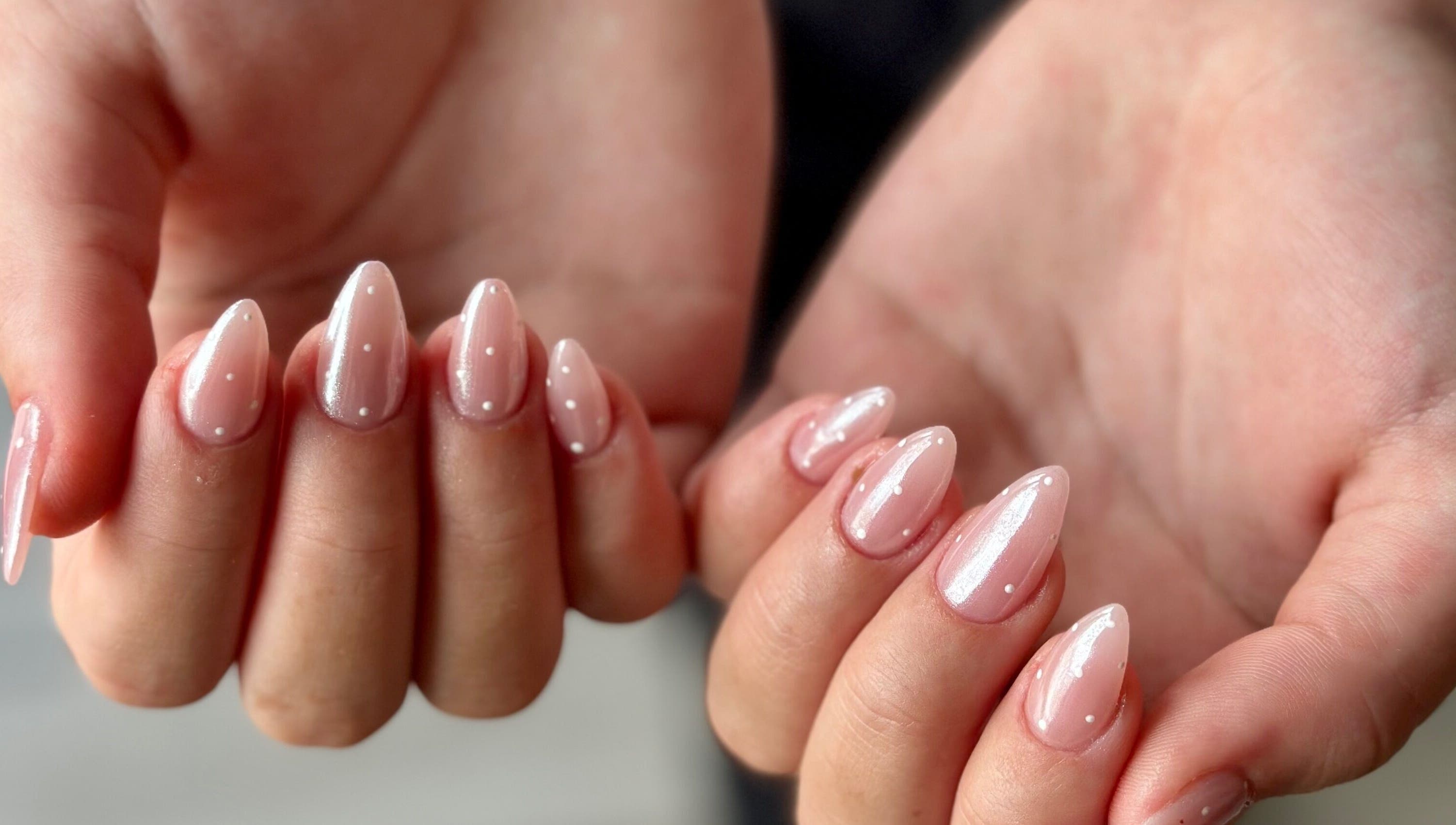 Chic nail design at WinWin Nails and Spa, Windermere, Florida, US, featuring glossy pink polish.