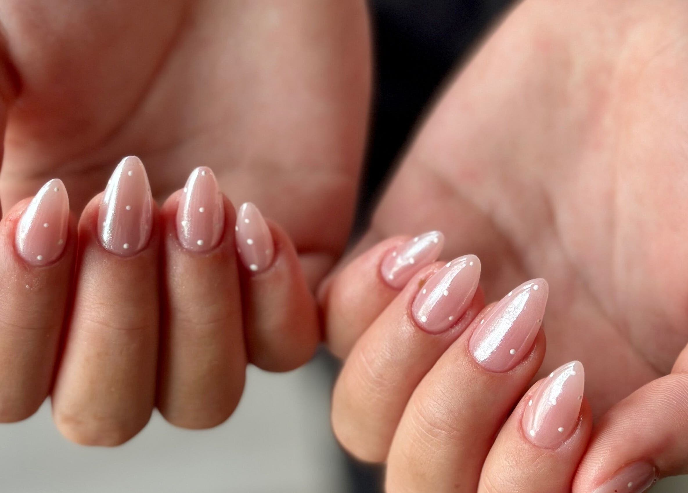 Chic nail design at WinWin Nails and Spa, Windermere, Florida, US, featuring glossy pink polish.