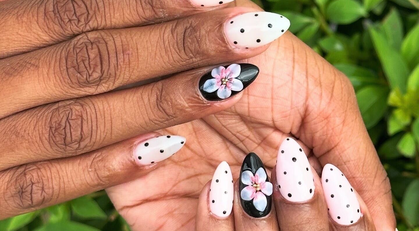 Elegant black and white floral nail design at WinWin Nails and Spa, Windermere, Florida, US.