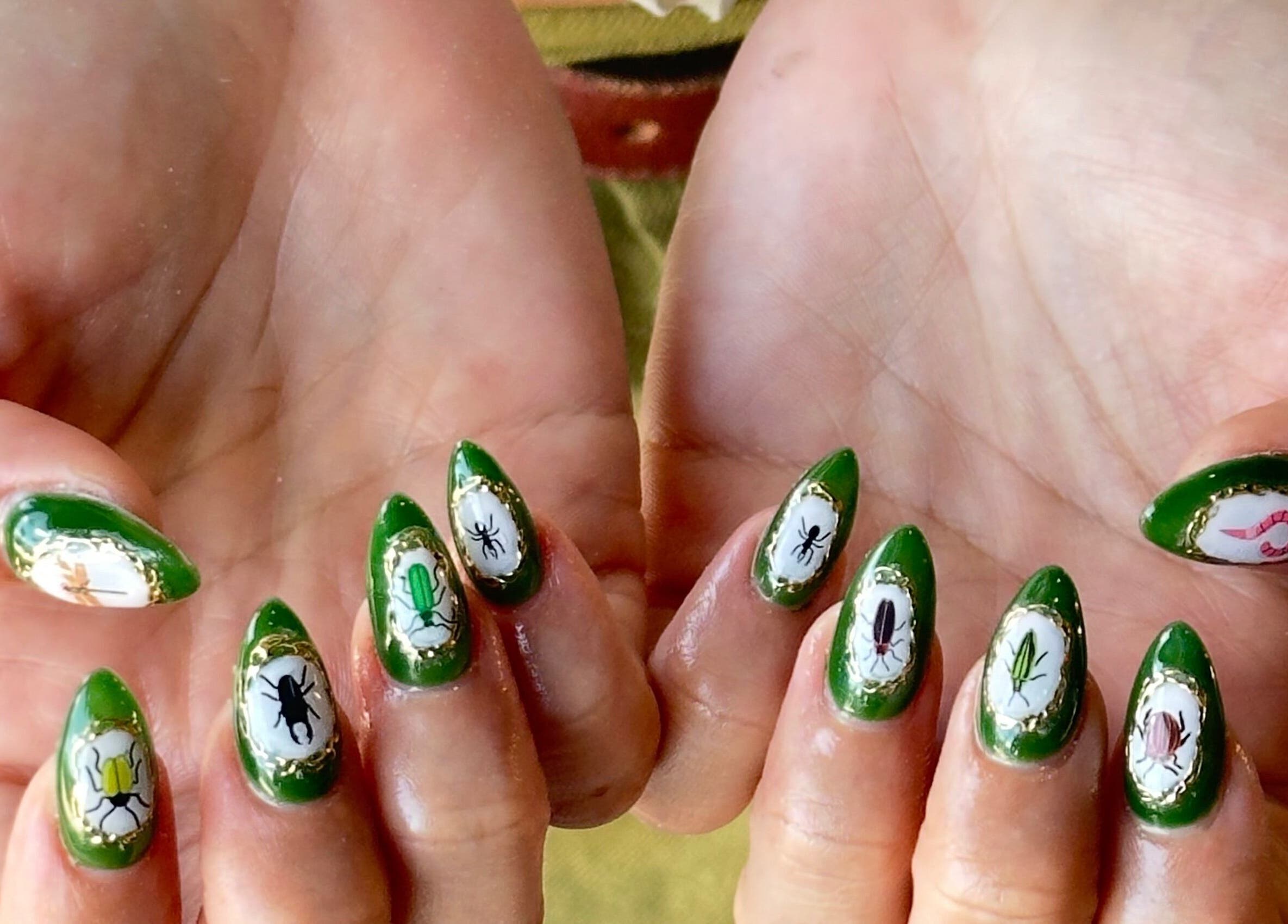 Unique green nail art at WinWin Nails and Spa in Windermere, Florida, US, showcasing vibrant custom designs.