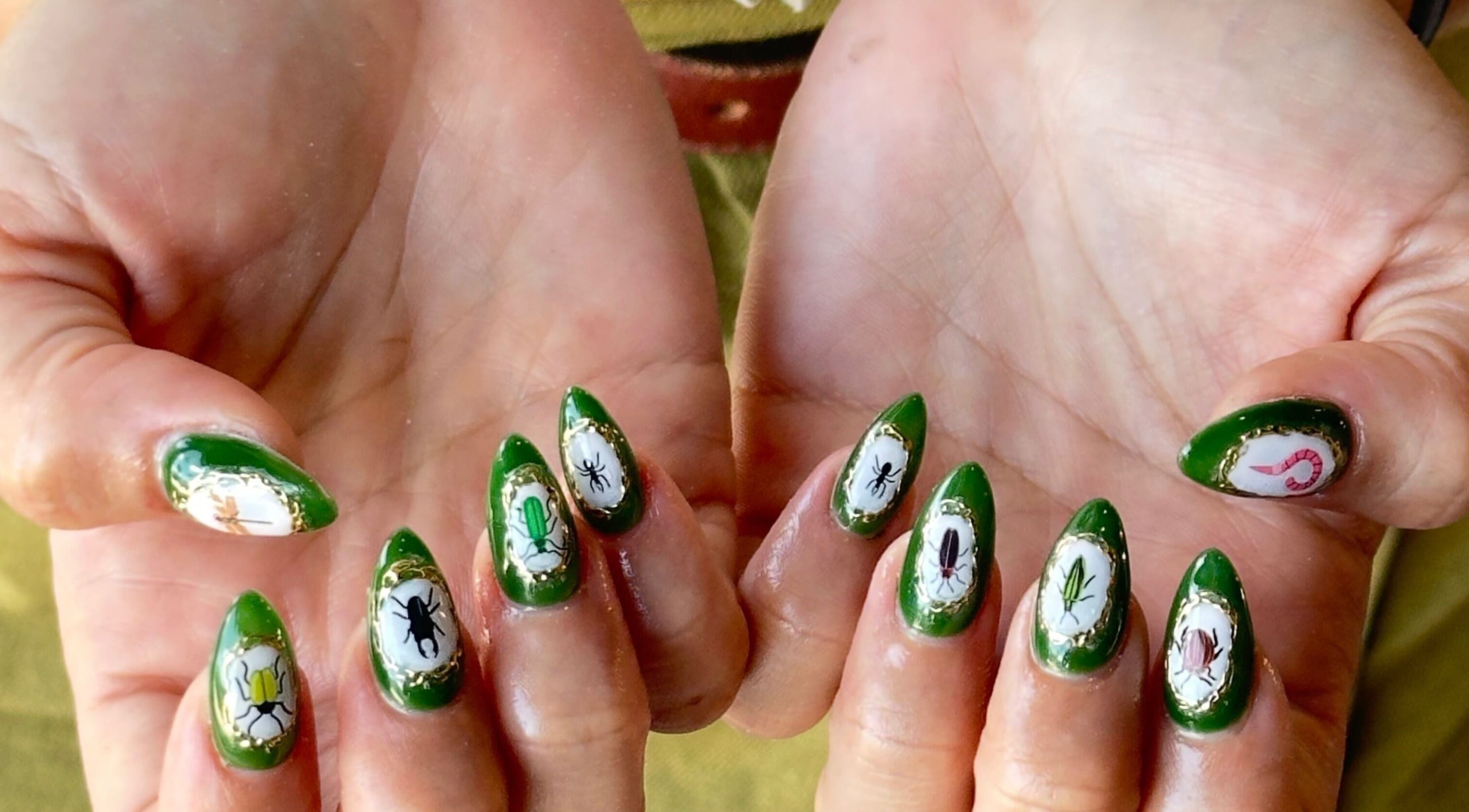 Unique green nail art at WinWin Nails and Spa in Windermere, Florida, US, showcasing vibrant custom designs.