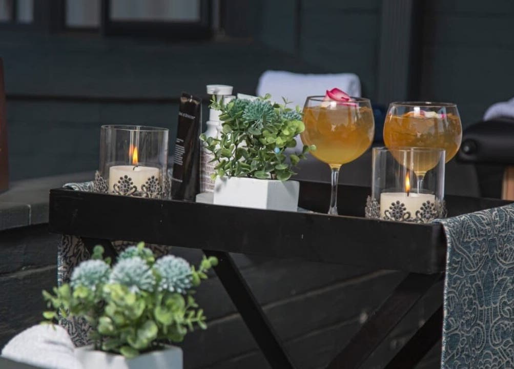 Relaxing spa setup at Emihle Wellness & Mobile Spa, Berea, Kwazulu-natal, ZA with candles and drinks.