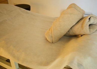 Massage table and towels at Zen Japanese Massage - Enmore, Enmore, New South Wales, AU, highlight relaxation.