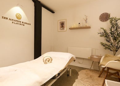 Calming massage room at Zen Japanese Massage Platinum - Surry Hills, New South Wales, AU, with a cozy setup.