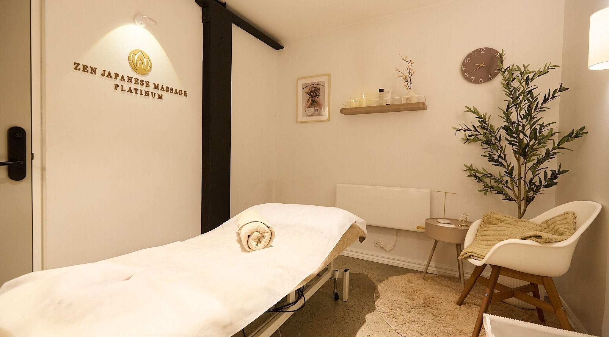 Calming massage room at Zen Japanese Massage Platinum - Surry Hills, New South Wales, AU, with a cozy setup.