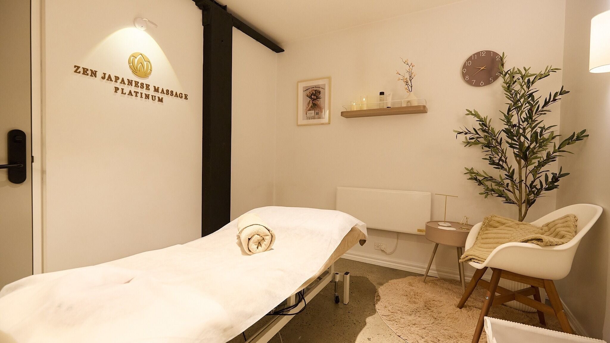 Calming massage room at Zen Japanese Massage Platinum - Surry Hills, New South Wales, AU, with a cozy setup.