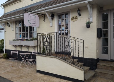 Grecian Health and Beauty Bishampton England GB entrance with vintage decor and cozy seating.