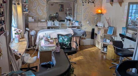Relaxing treatment room at Grecian Health and Beauty in Bishampton, England, GB, featuring a cozy and elegant design.