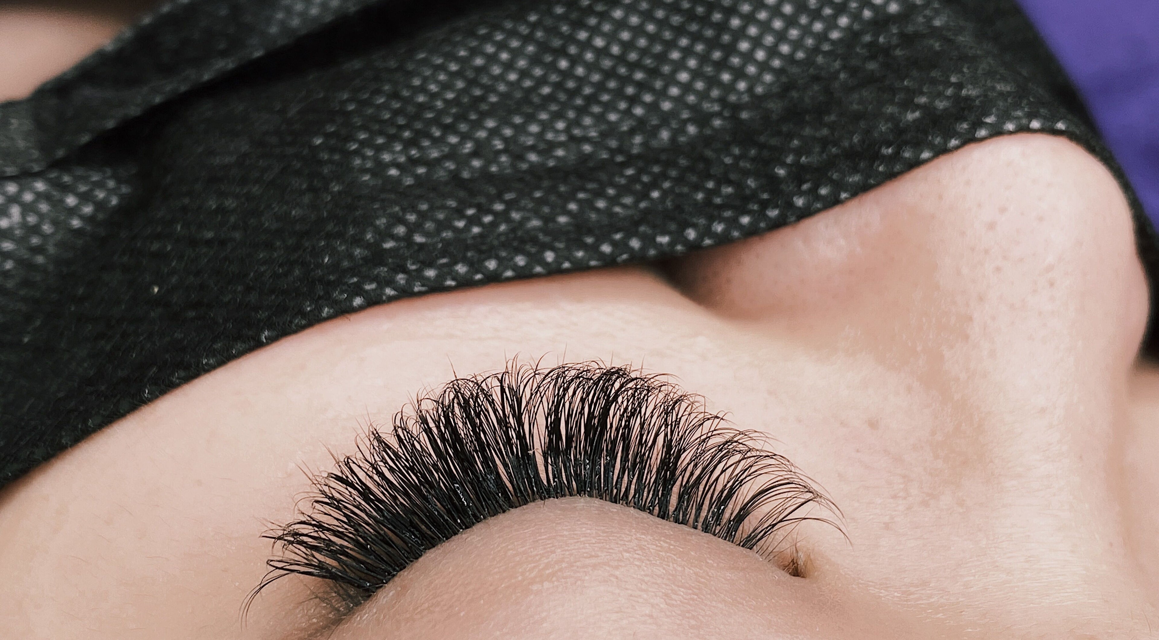 Close-up of luxurious lash extensions at YV LASHES & BROWS, Redondo Beach, California, US.