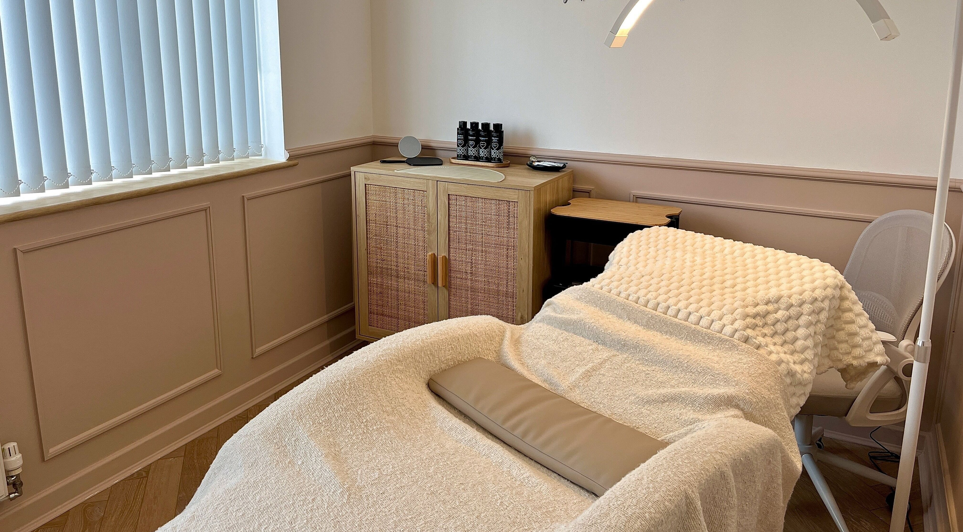 Relaxing treatment room at Jade Carla Beauty, Southport, England, GB with a plush bed and elegant decor.