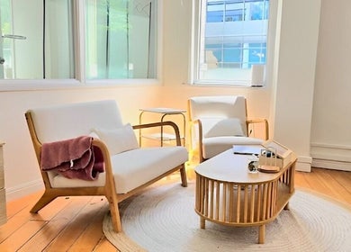 Inviting lounge area at Evarin Lash & Beauty, Fortitude Valley, Queensland, AU, with soft chairs and natural light.