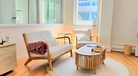Inviting lounge area at Evarin Lash & Beauty, Fortitude Valley, Queensland, AU, with soft chairs and natural light.
