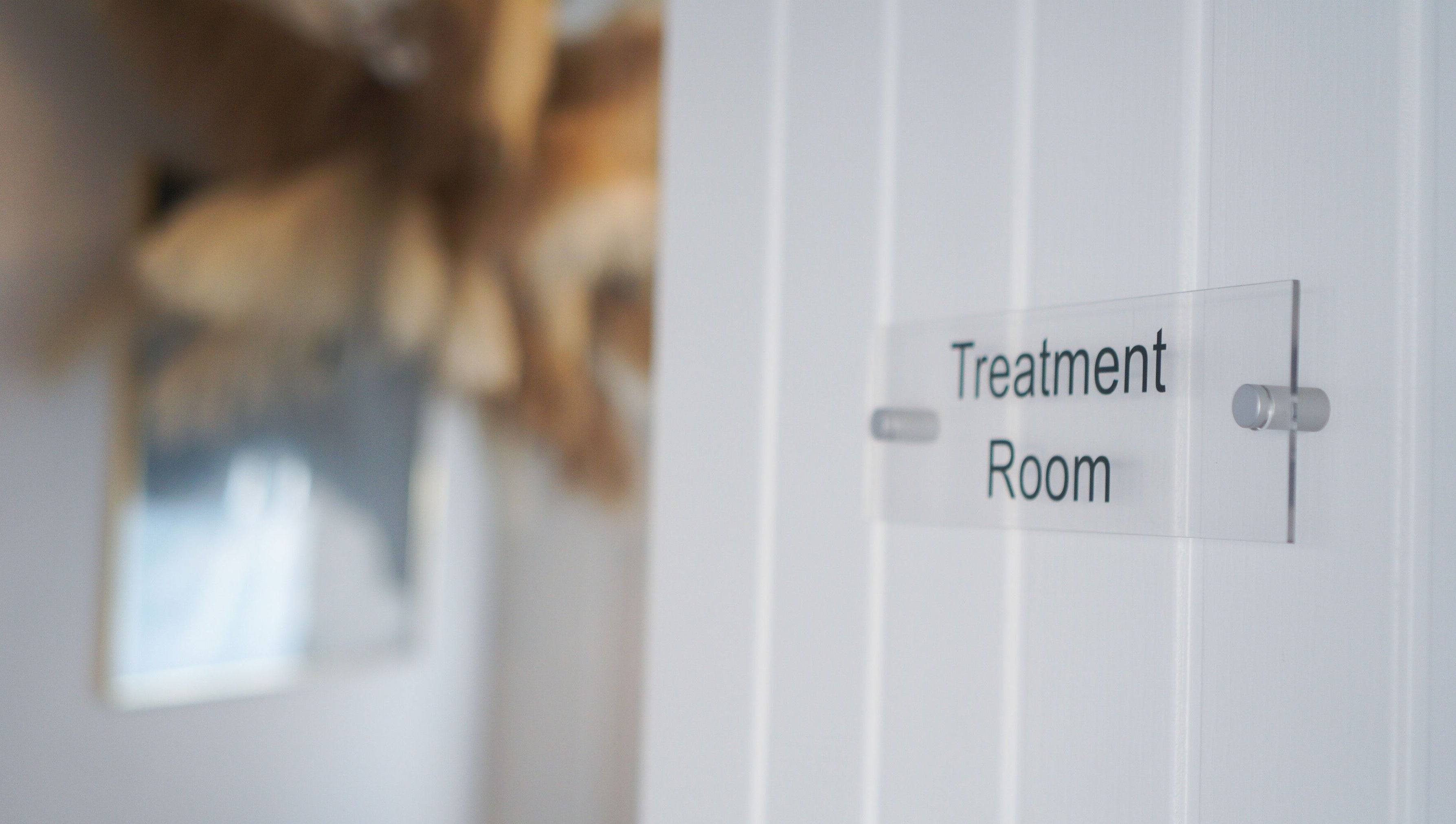 Calm treatment room sign at Iridescent, Guisborough, England, GB welcoming relaxation and wellness.