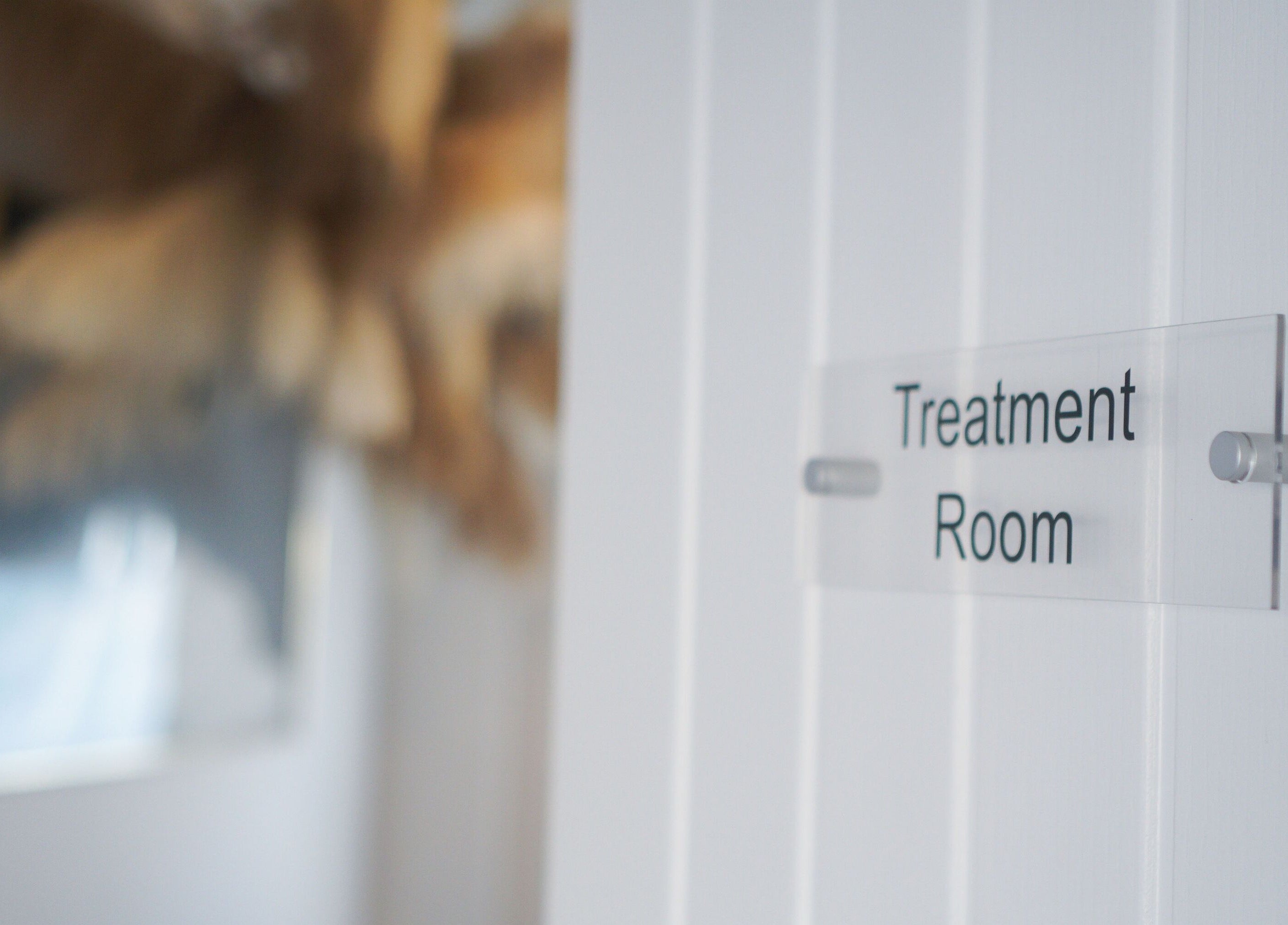 Calm treatment room sign at Iridescent, Guisborough, England, GB welcoming relaxation and wellness.