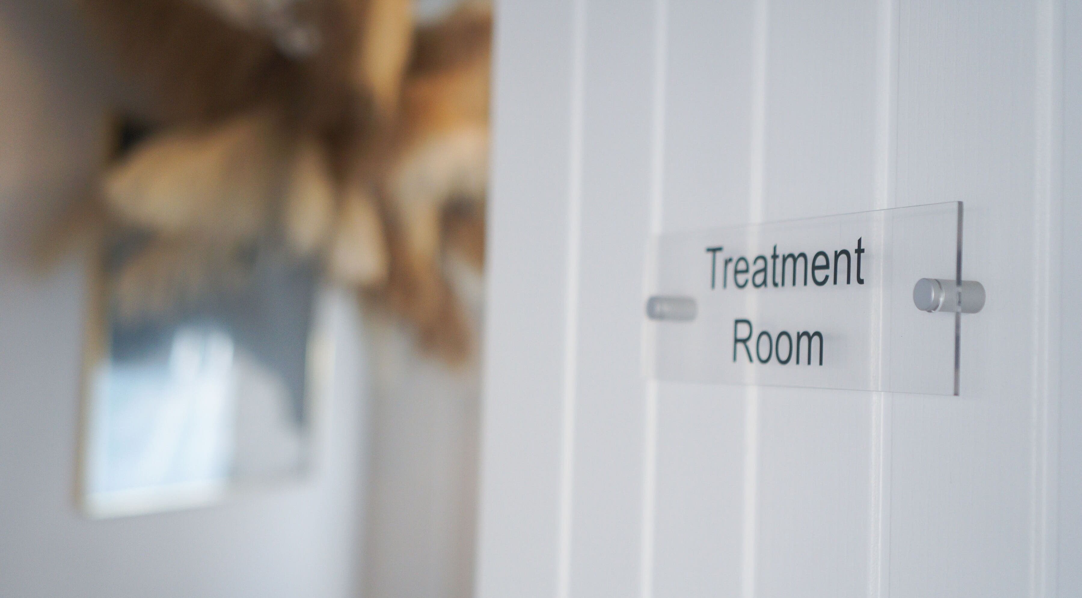 Calm treatment room sign at Iridescent, Guisborough, England, GB welcoming relaxation and wellness.
