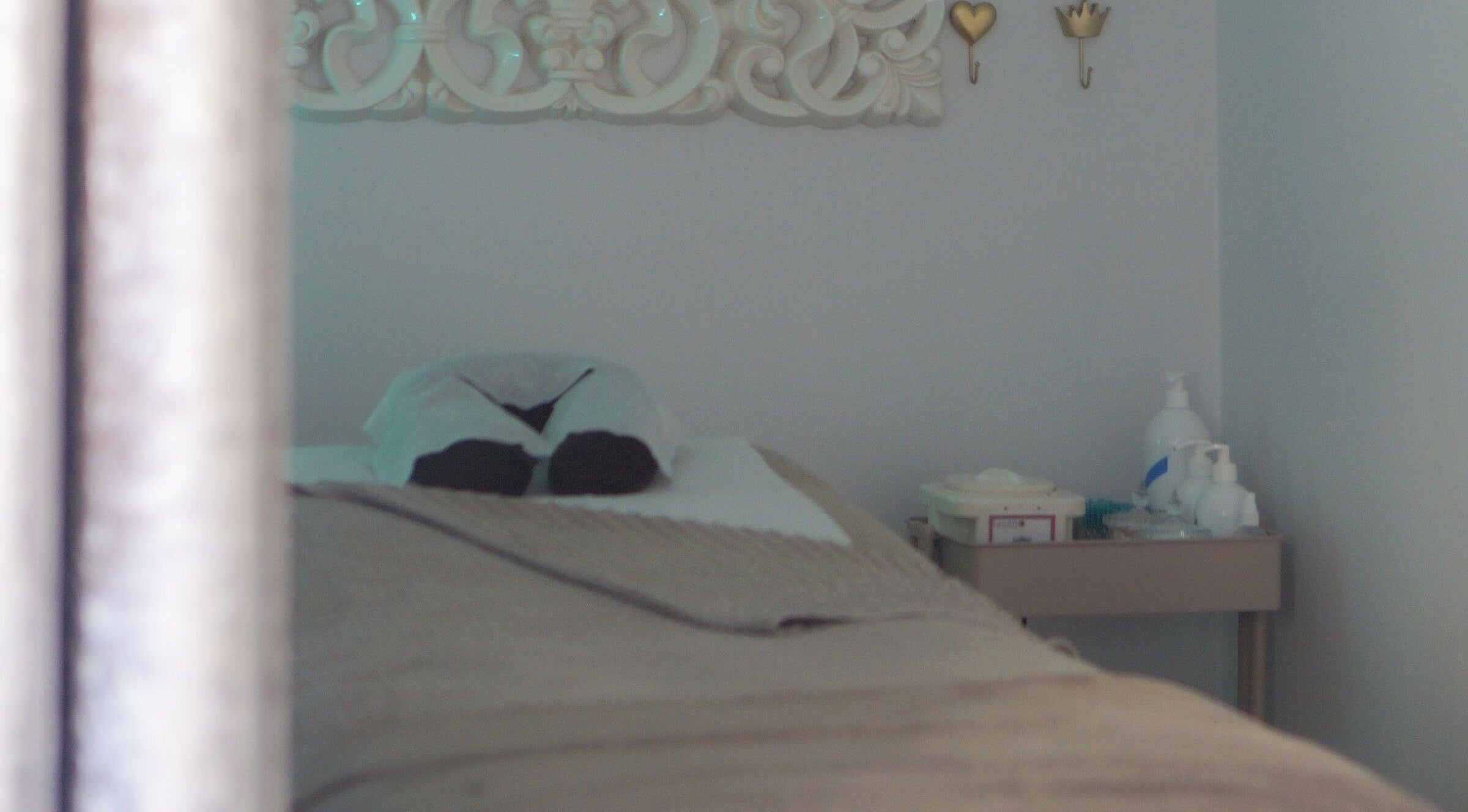 Cozy massage table at Iridescent, Guisborough, England, GB, ready for a relaxing spa treatment.