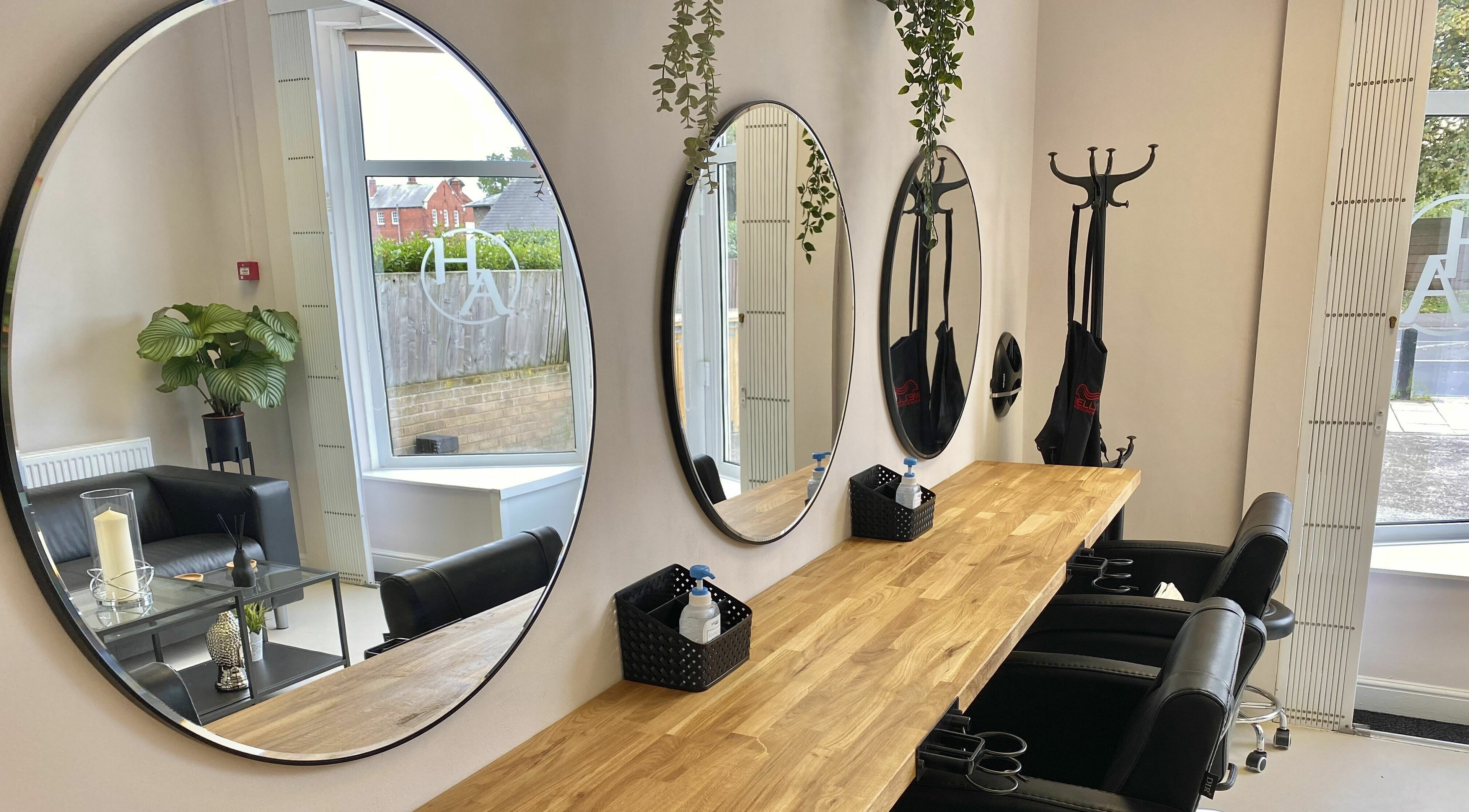 Elegant hairdressing mirrors at Harriet Amy Hairdressing, Bridlington, England, GB, showcasing modern salon interior.